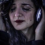 woman, tears, headphones-5725319.jpg